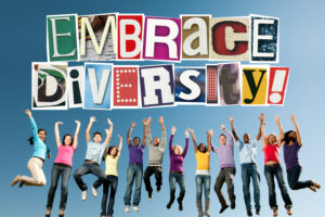 group of people jumping into the air with arms outstretched towards the words Embrace Diversity